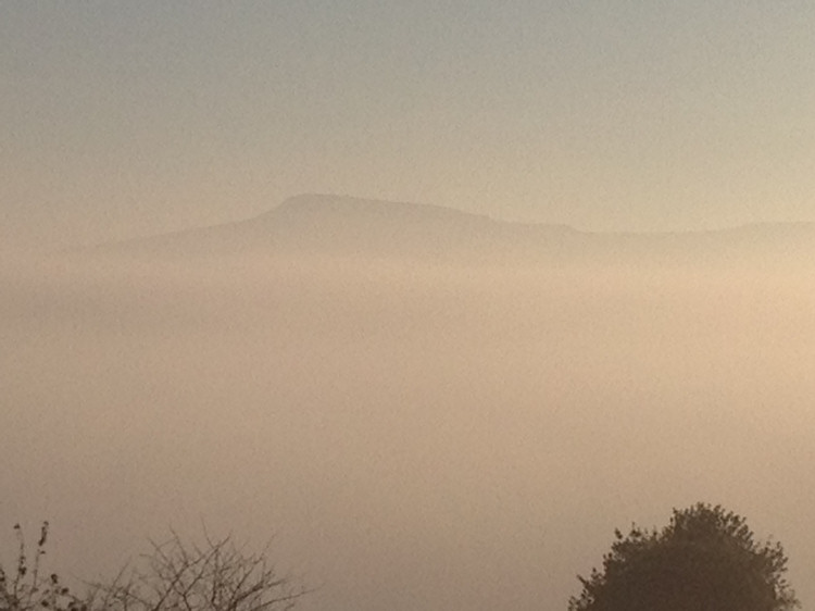 Titterstone Clee emerging from the fog