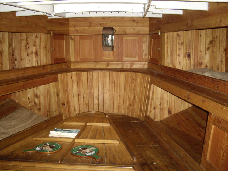 The crew cabin: eight bunks and a table