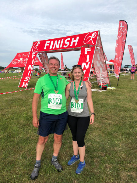 Neil and Tahni with their Cheddar Gorge 6k Trail Race medals