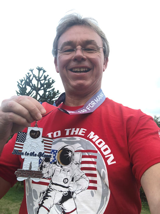 Neil with Run to the Moon shirt and medal